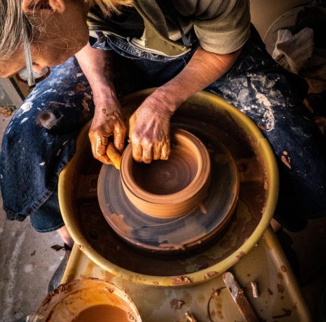 Hands on potters wheel
