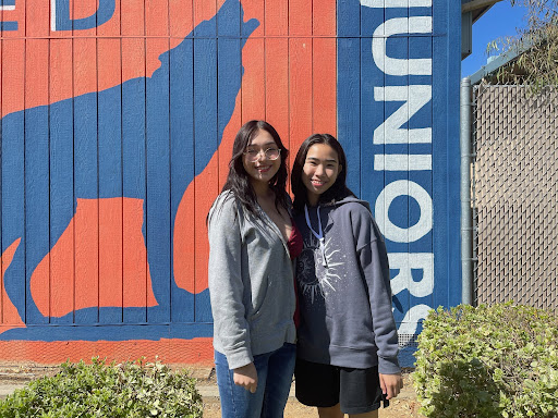 Art For Charity co-founders Alyssa Jordan Perez (pictured right) and Jaslyn Ng (pictured left) in front of the Consumnes Oaks High School junior class mural.