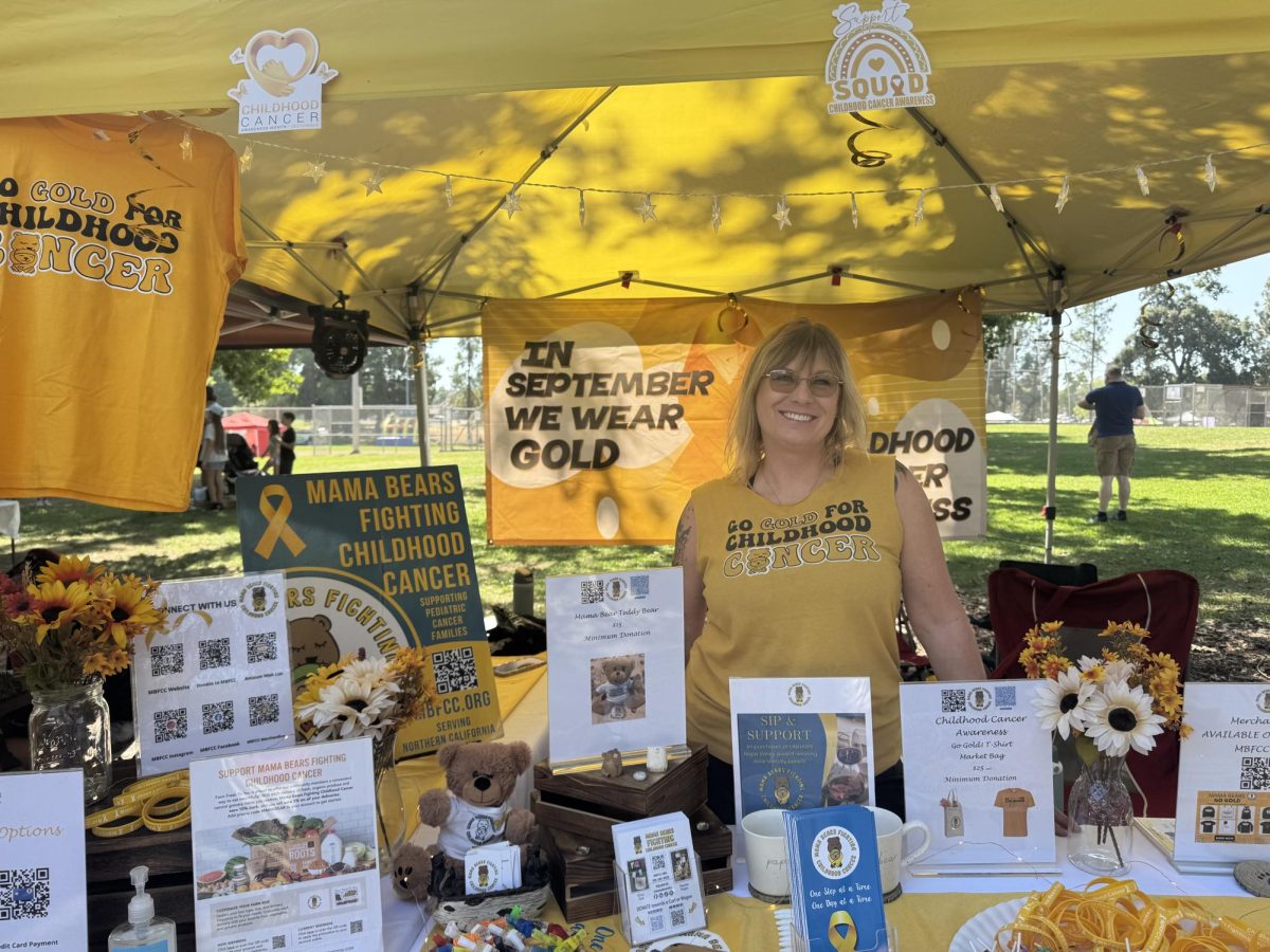 Debie Mitchell, the president of Mama Bears Fighting Childhood Cancer organization, helped staff a booth to raise awareness of childhood cancer at the annual Fair Oaks Chicken Festival in September..