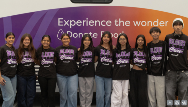 Pleasant Grove High School's Biomedical Academy blood drive team in front of the Vitalant blood drive van. // photo by Lugtxug Her